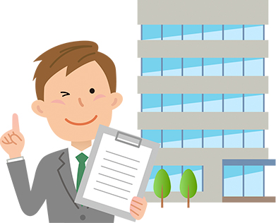 ビルの前に立つ男性